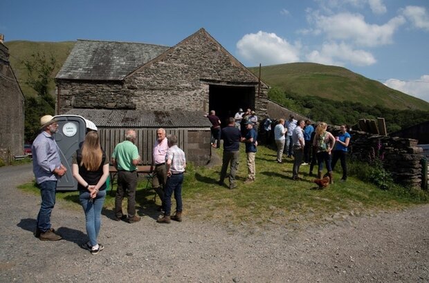 A gathering of pilot participants on a farm