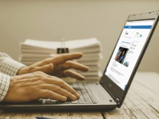 Hands of man typing at laptop showing the Farming blog homepage