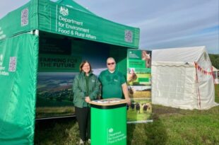 Trevor, member of the engagement team stands alongside a defra ambassador in the sunshine